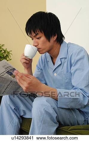 Man relaxing in the room View Large Photo Image Stock Image - Man relaxing in the room. Fotosearch