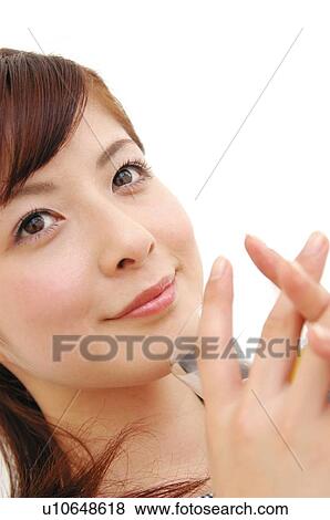Stock Photo - Woman drinking a juice, Close-up. Fotosearch