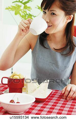 Woman eating lunch View Large Photo Image Picture - Woman eating lunch. Fotosearch