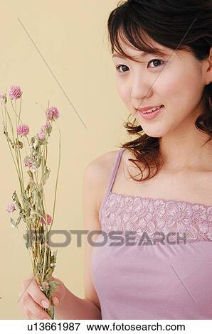 Woman having flowers View Large Photo Image Stock Photo - Woman having flowers. Fotosearch