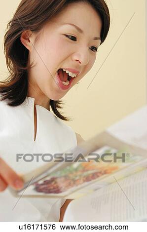 Woman reading an English book View Large Photo Image Stock Photograph - Woman reading an English book. Fotosearch