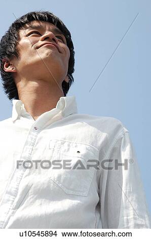 Picture - Woman under the sky. Fotosearch