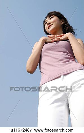 Woman under the sky View Large Photo Image Stock Photo - Woman under the sky. Fotosearch