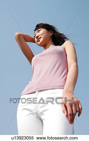 Stock Photography - Woman under the sky. Fotosearch