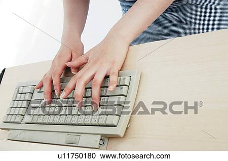 Woman using a PC View Large Photo Image Stock Image - Woman using a PC. Fotosearch