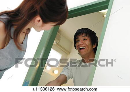 Stock Photograph - Woman visiting boyfriend's house. Fotosearch