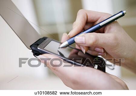 Using PDA View Large Photo Image Stock Image - Using PDA. Fotosearch