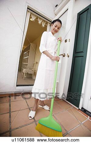 Stock Photo - Young Woman Cleaning. Fotosearch