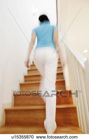 Young Woman Going Upstairs View Large Photo Image Stock Image - Young Woman Going Upstairs. Fotosearch