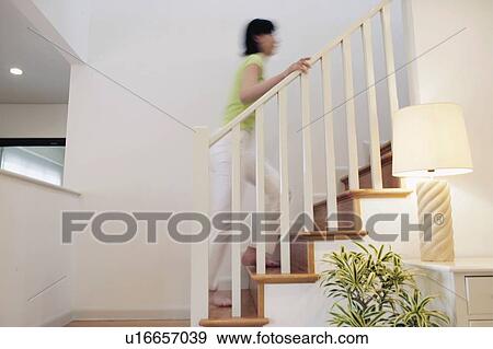 Young Woman Going Upstairs View Large Photo Image Stock Photo - Young Woman Going Upstairs. Fotosearch