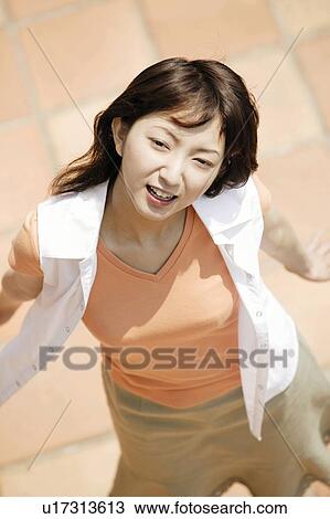 Stock Image - Young Woman Looking Away. Fotosearch