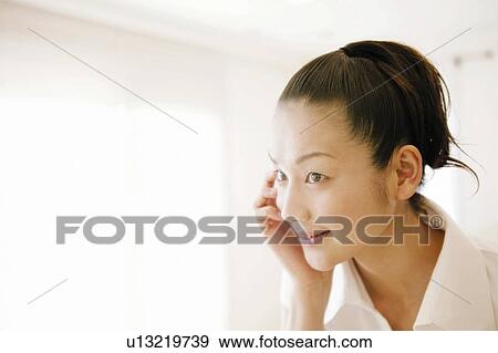Stock Photo - Young Woman Looking Away. Fotosearch