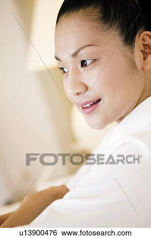 Stock Photograph - Young Woman Looking Away. Fotosearch