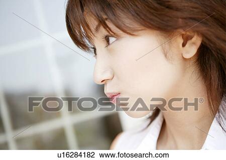 Stock Image - Young Woman Making Face. Fotosearch