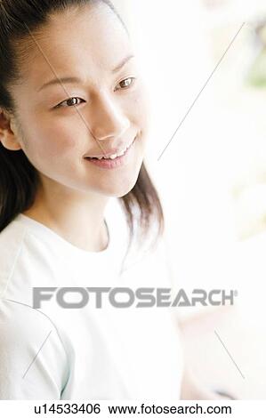 Stock Photograph - Young Woman, Side view. Fotosearch