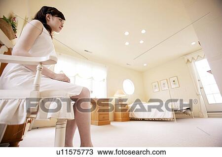 Young Woman Sitting On Chair View Large Photo Image Stock Image - Young Woman Sitting On Chair. Fotosearch