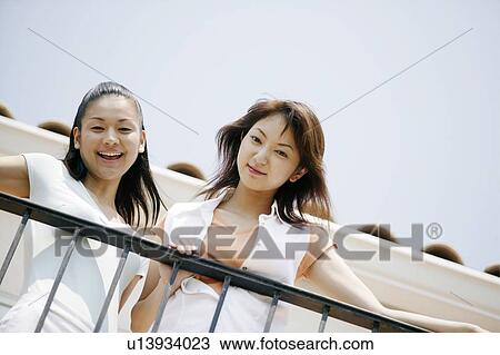 Young Women Looking Down View Large Photo Image Stock Image - Young Women Looking Down. Fotosearch