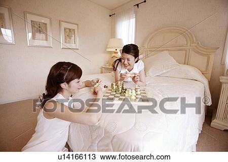 Young Women Playing Chess View Large Photo Image Stock Image - Young Women Playing Chess. Fotosearch