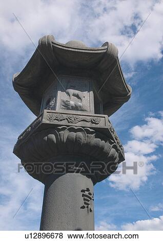 Stock Photo - Pillar, Carved, Sky, Clouds, Tall, Structure. Fotosearch