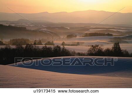 Stock Photography - Snowy landscape in the morning, high angle view, Kamifurano town, Hokkaido, Japan. Fotosearch