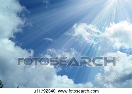Sunshine and clouds in the blue sky, low angle view, lens flare View Large Photo Image Stock Image - Sunshine and clouds in the blue sky, low angle view, lens flare. Fotosearch