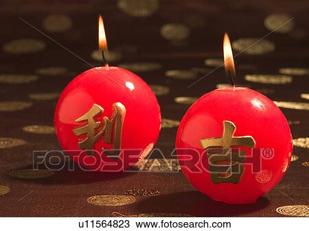 Stock Image - Chinese New Year, Celebrations, New Year, Burning, Candle, Chinese Script, Close-Up. Fotosearch