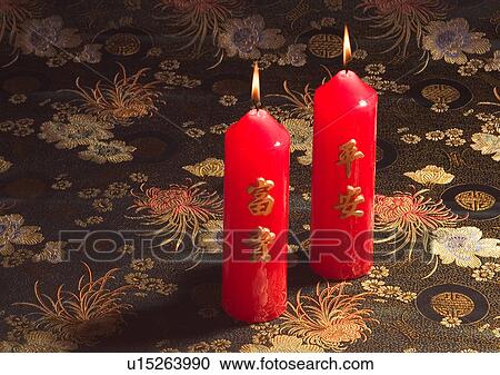 Stock Image - Chinese New Year, Celebrations, New Year, Burning, Candle, Chinese Script, Close-Up. Fotosearch