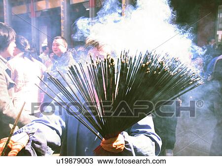 Stock Image - Chinese New Year, Celebrations, New Year, Burning, Casual Clothing, Close-Up. Fotosearch