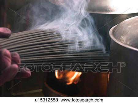 Stock Photo - Chinese New Year, Celebrations, New Year, Bunch, Burning, Close-Up. Fotosearch