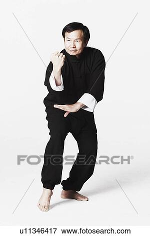 Mature man practicing martial arts View Large Photo Image Stock Photo - Mature man practicing martial arts. Fotosearch