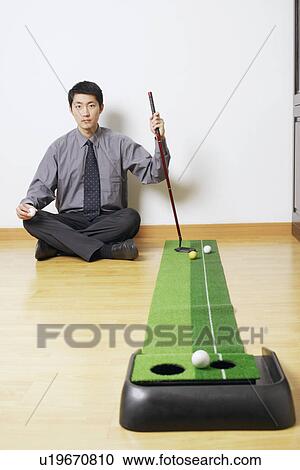 Portrait of a businessman sitting on the floor View Large Photo Image Stock Image - Portrait of a businessman sitting on the floor. Fotosearch