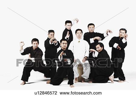 Stock Image - Portrait of a group of people practicing martial arts. Fotosearch