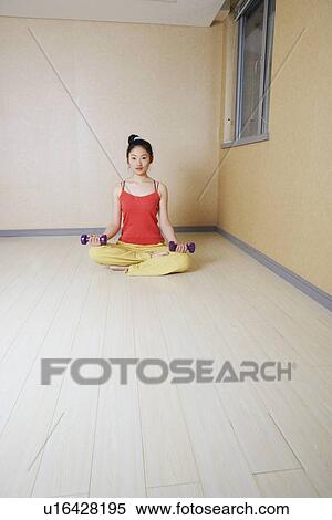 Portrait of a teenage girl exercising with dumbbells View Large Photo Image Stock Photography - Portrait of a teenage girl exercising with dumbbells. Fotosearch