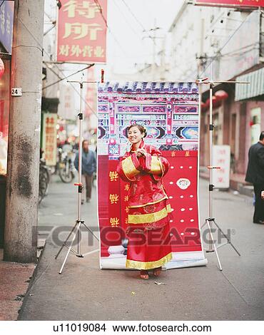 Young woman in the traditional clothing View Large Photo Image Picture - Young woman in the traditional clothing. Fotosearch
