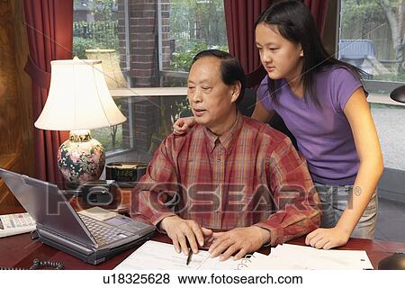 Stock Photo - Close-up of a grandfather and his granddaughter. Fotosearch