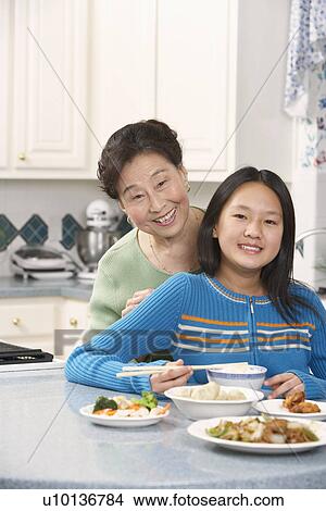 Portrait of a girl and her grandmother View Large Photo Image Picture - Portrait of a girl and her grandmother. Fotosearch