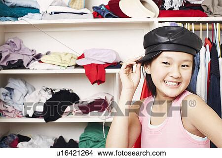 Picture - Portrait of a girl wearing a cap. Fotosearch