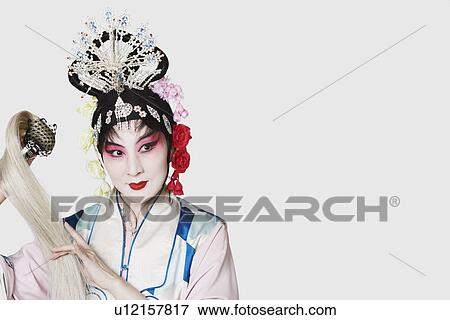 Stock Photo - Close-up of a mature woman wearing traditional clothing. Fotosearch