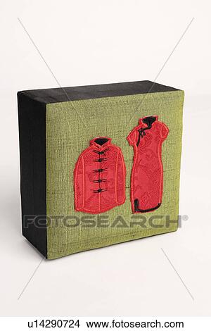 Picture - Close-up of traditional Chinese outfits embroidered on a box. Fotosearch
