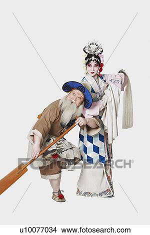 Picture - Mid adult man and a mature woman wearing traditional clothing. Fotosearch