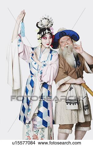 Mid adult man and a mature woman wearing traditional clothing View Large Photo Image Picture - Mid adult man and a mature woman wearing traditional clothing. Fotosearch