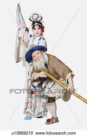 Mid adult man and a mature woman wearing traditional clothing View Large Photo Image Stock Image - Mid adult man and a mature woman wearing traditional clothing. Fotosearch