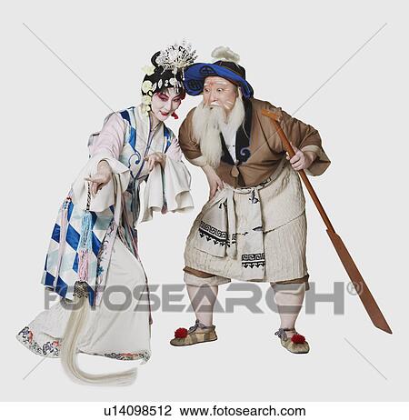 Stock Image - Mid adult man and a mature woman wearing traditional clothing. Fotosearch