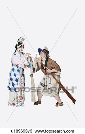 Stock Image - Mid adult man and a mature woman wearing traditional clothing. Fotosearch