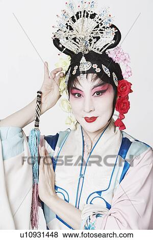 Stock Photo - Portrait of a mature woman wearing traditional clothing. Fotosearch