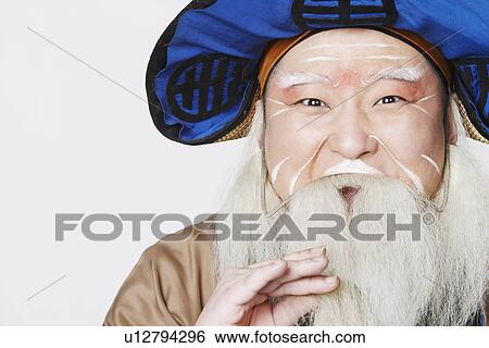 Stock Photograph - Portrait of a mid adult man wearing traditional clothing. Fotosearch
