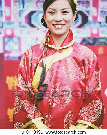 Portrait of a young woman in the traditional clothing View Large Photo Image Stock Photography - Portrait of a young woman in the traditional clothing. Fotosearch