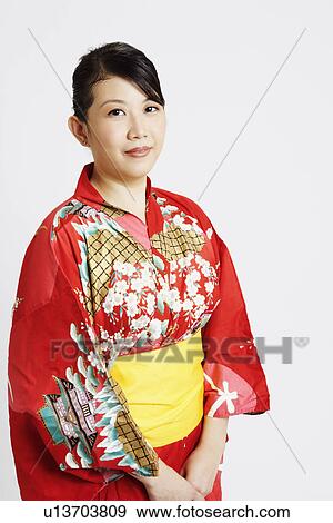 Portrait of a young woman wearing traditional clothing View Large Photo Image Stock Photo - Portrait of a young woman wearing traditional clothing. Fotosearch