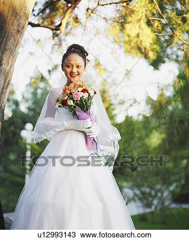 Portrait of a young woman in the wedding dress View Large Photo Image Stock Image - Portrait of a young woman in the wedding dress. Fotosearch