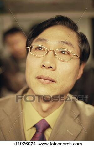 Close-up of a businessman View Large Photo Image Picture - Close-up of a businessman. Fotosearch
